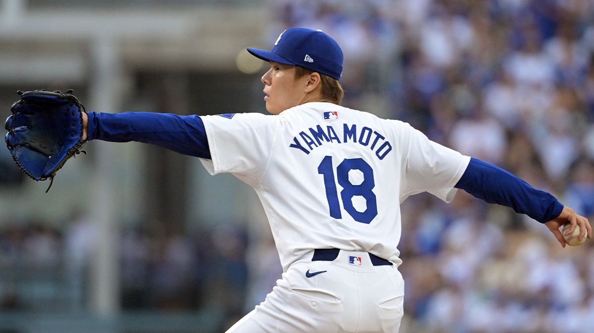 Los Angeles Dodgers pitcher Yoshinobu Yamamoto (18) pitches against the San Diego Padres in the second inning during game five of the NLDS for the 2024 MLB Playoffs at Dodger Stadium.