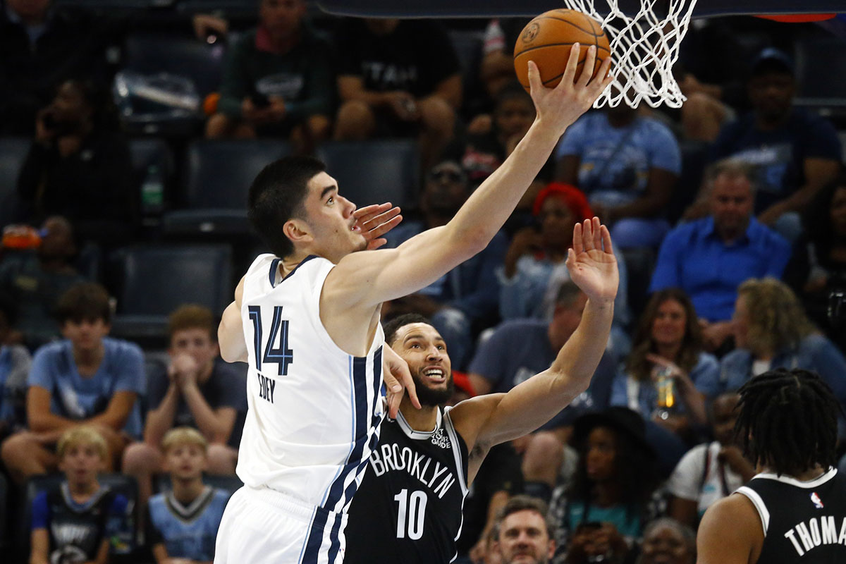 Memphis Grizzlies center Zach Edey (14) shoots as Brooklyn Nets guard Ben Simmons (10) defends during the first half at FedExForum.