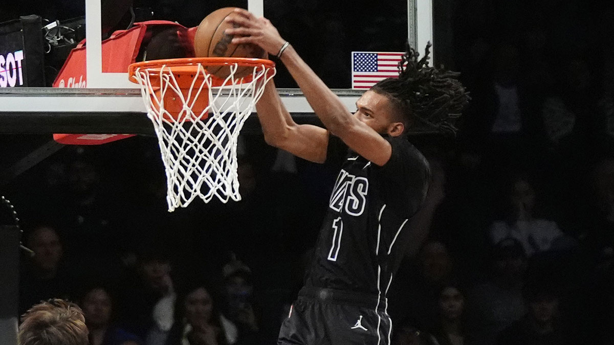 Brooklyn Nets forward Ziaire Williams (1) dunks the ball against the Denver Nuggets during the first half of the game at Barclays Center.