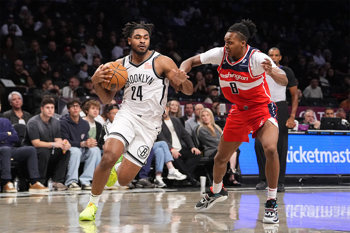 Brooklyn Nets small guard Cam Thomas (24) drives the ball against Washington Wizards guard Bub Carrington (8) during the first half at Barclays Center.