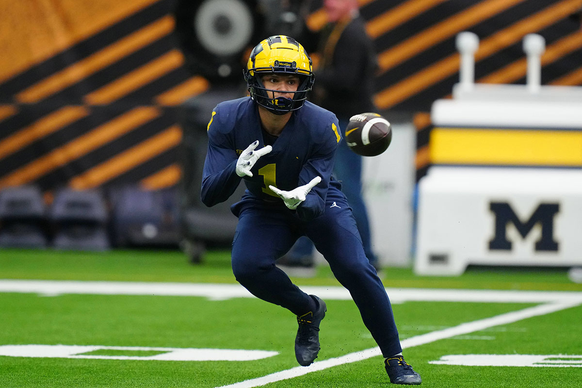Michigan Wolverines wide receiver Roman Wilson (1) catches the ball during a practice session before the College Football Playoff national championship game against the Washington Huskies at NRG Stadium.