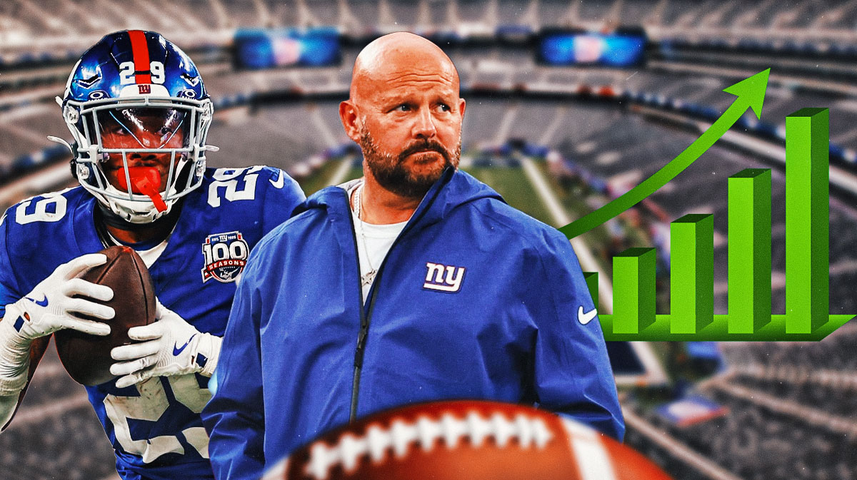 Tyrone Tracy and Brian Daboll with graphs that have green arrows pointing up
