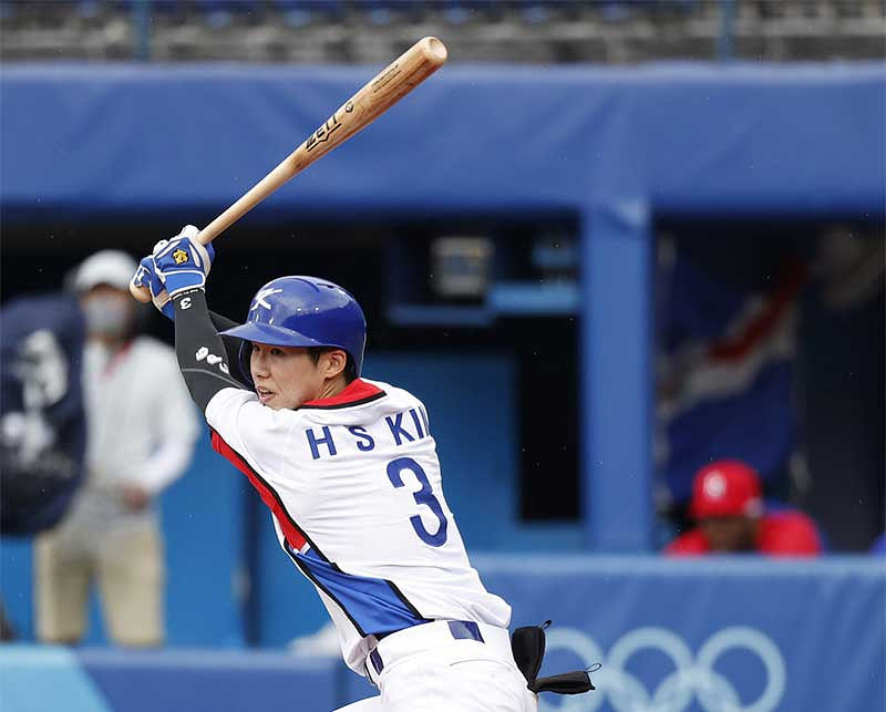 Team South Korea infielder Hyeseong Kim (3) hits a single against the Dominican Republic in the baseball bronze medal match during the Tokyo 2020 Olympic Summer Games at Yokohama Baseball Stadium.