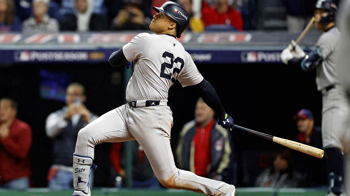 New York Yankees outfielder Juan Soto (22) hits a two run home run during the tenth inning against the Cleveland Guardians during game five of the ALCS for the 2024 MLB playoffs at Progressive Field.