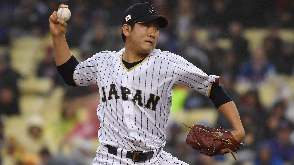 Japan pitcher Tomoyuki Sugano (11) throws a pitch during the first inning against United States during the 2017 World Baseball Classic at Dodger Stadium.