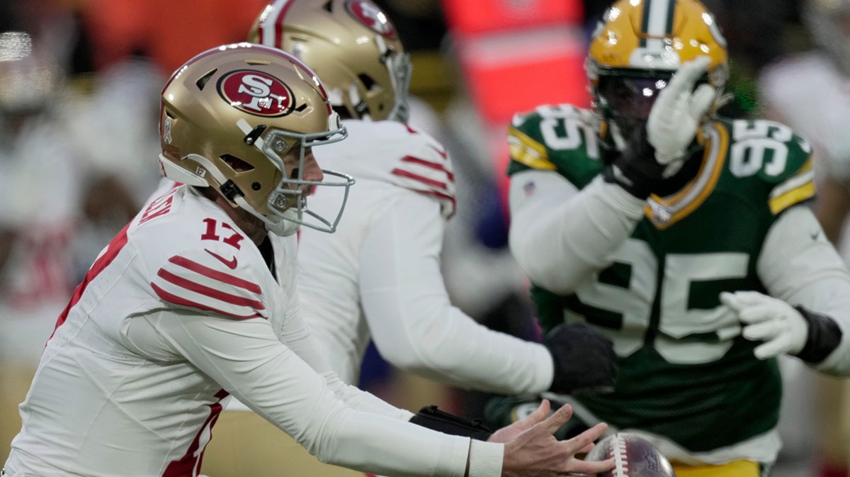 San Francisco 49ers quarterback Brandon Allen (17) recover his own fumble before being sacked by Green Bay Packers linebacker Quay Walker during the first quarter of their game Sunday, November 24, 2024 at Lambeau Field in Green Bay, Wisconsin. 