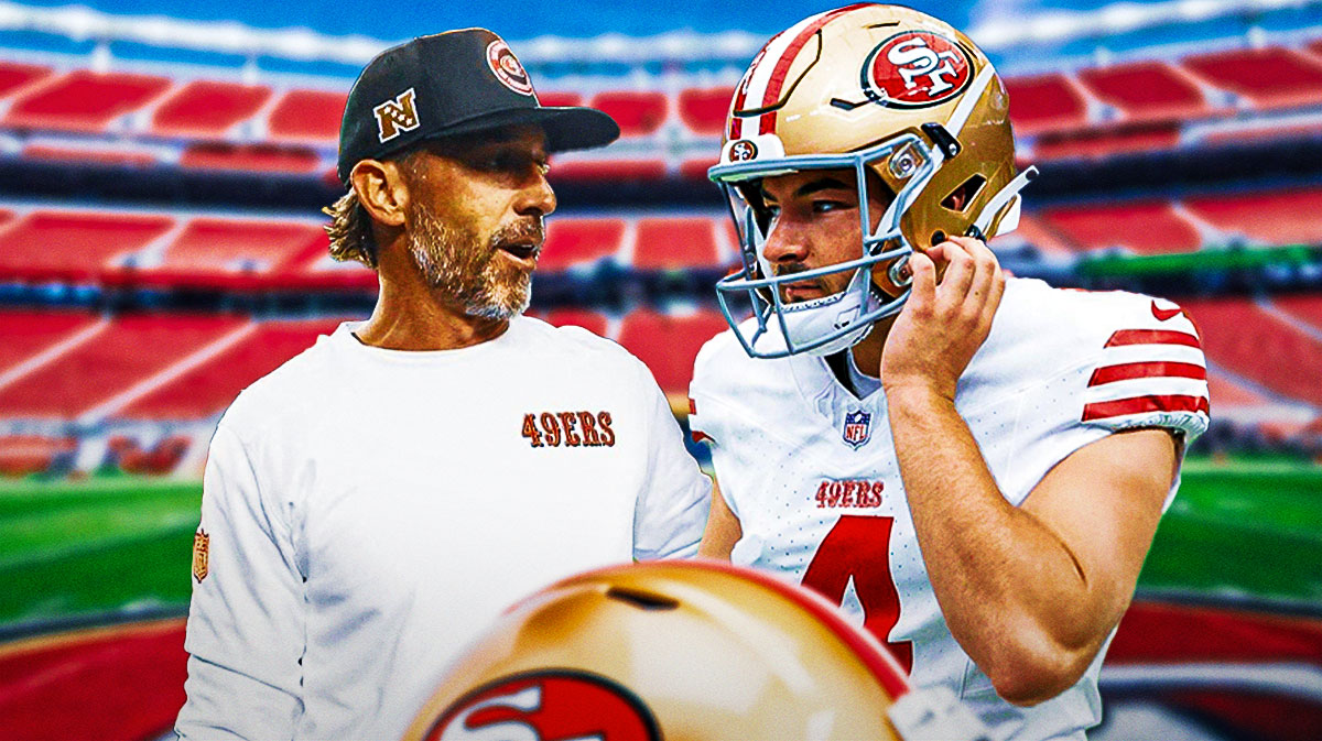 49ers head coach Kyle Shanahan with kicker Jake Moody, patting him on the back in support of him