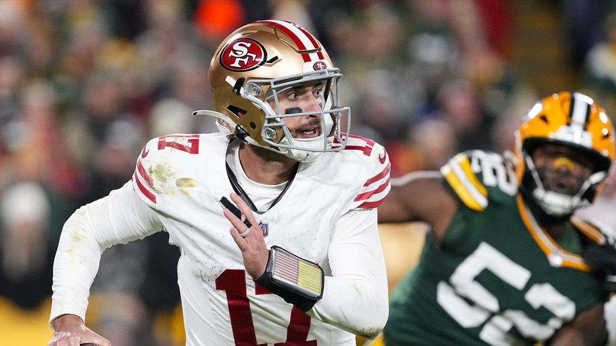 San Francisco 49ers quarterback Brandon Allen (17) scrambles away from pressure applied by Green Bay Packers defensive lineman Rashan Gary (52) during the fourth quarter at Lambeau Field.