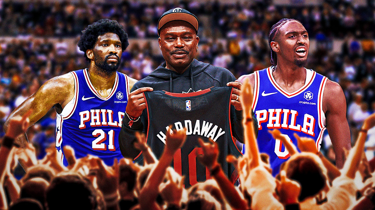 Tim Hardaway Sr. holding a Heat jersey between Tyrese Maxey and Joel Embiid of the 76ers