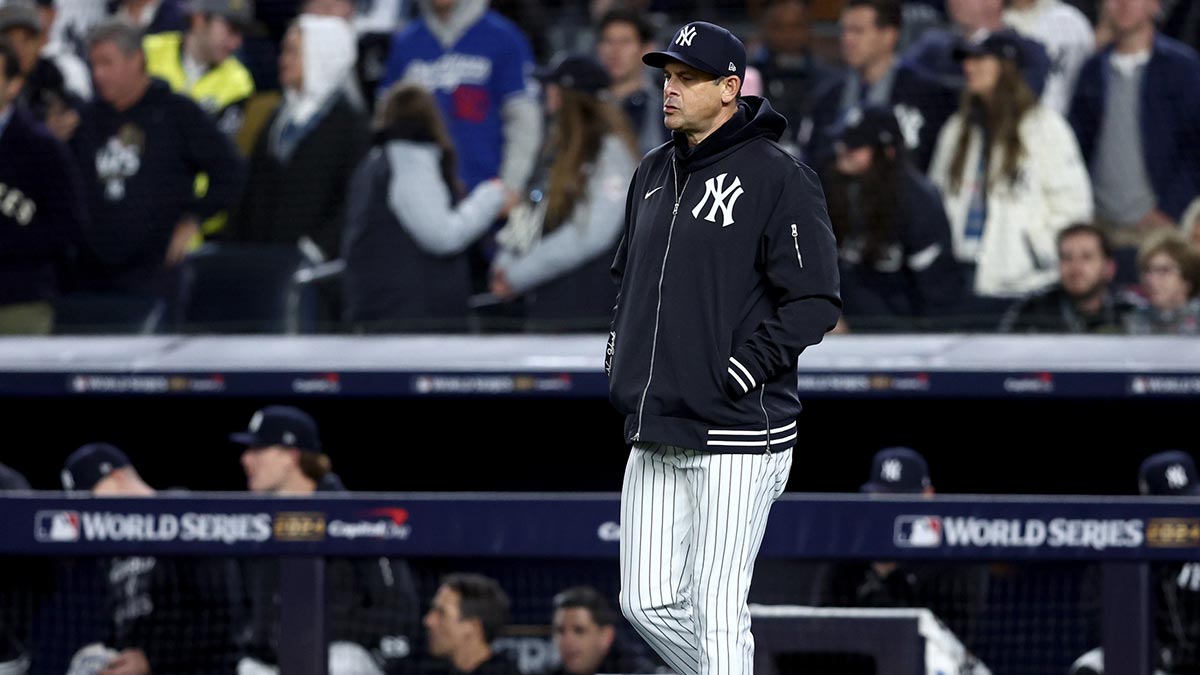 New York Yankees manager Aaron Boone (17) makes a pitching change during the third inning in game three of the 2024 MLB World Series against the Los Angeles Dodgers at Yankee Stadium.