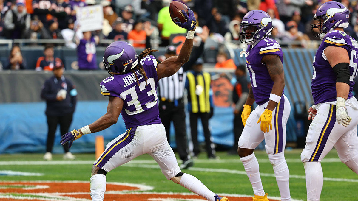 Minnesota Vikings running back Aaron Jones (33) reacts after scoring a touchdown against the Chicago Bears during the second half at Soldier Field.