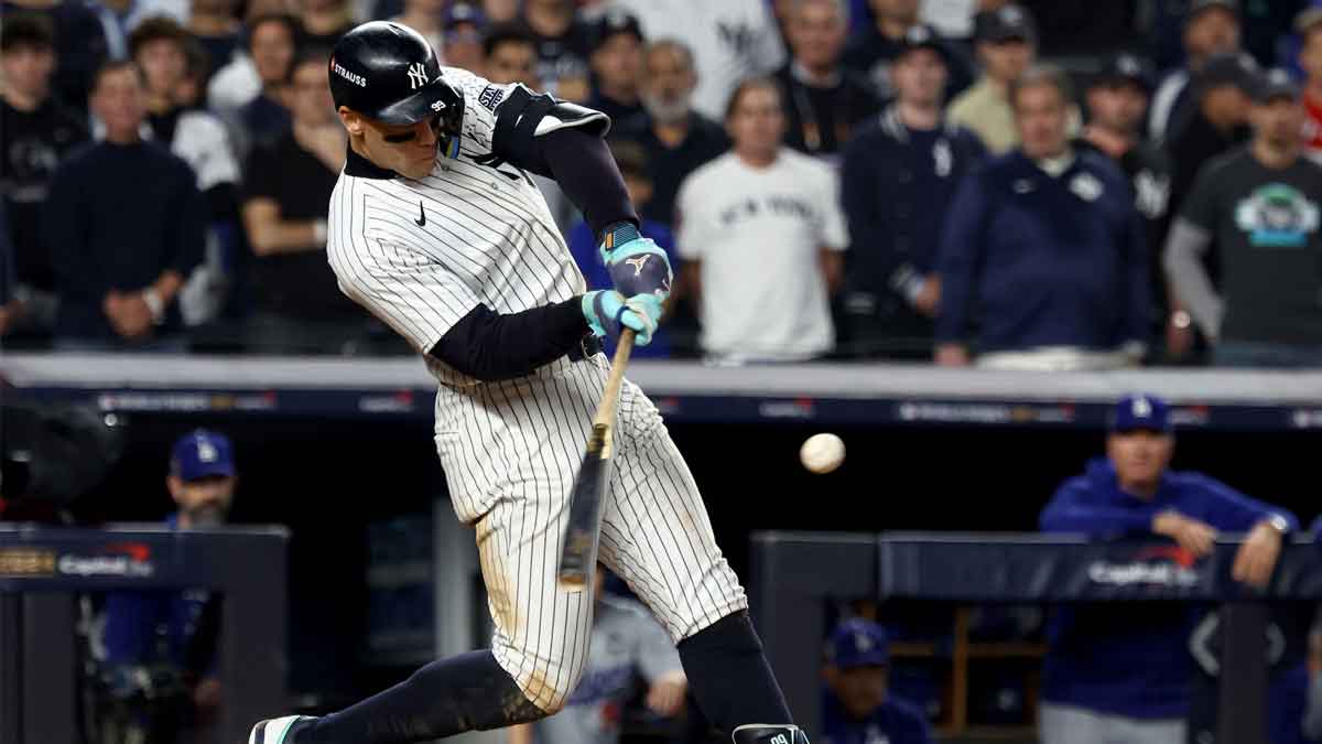 New York Yankees outfielder Aaron Judge (99) doubles during the eighth inning against the Los Angeles Dodgers in game five of the 2024 MLB World Series at Yankee Stadium. 