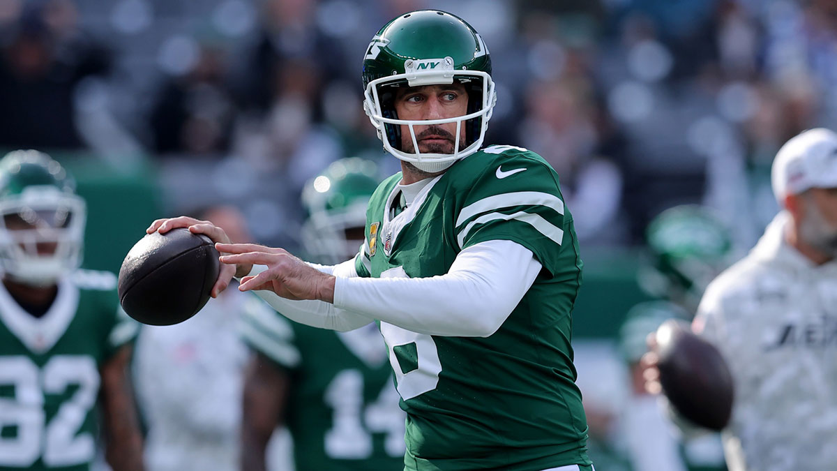 New York Jets quarterback Aaron Rodgers (8) warms up before a game against the Indianapolis Colts at MetLife Stadium.