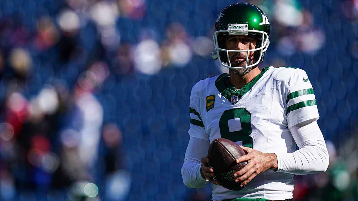 Jets quarterback Aaron Rodgers (8) warms up before the start of the game against the New England Patriots at Gillette Stadium.
