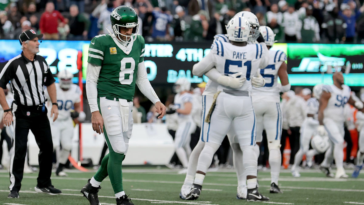 New York Jets quarterback Aaron Rodgers (8) walks off the field after losing to the Indianapolis Colts at MetLife Stadium.