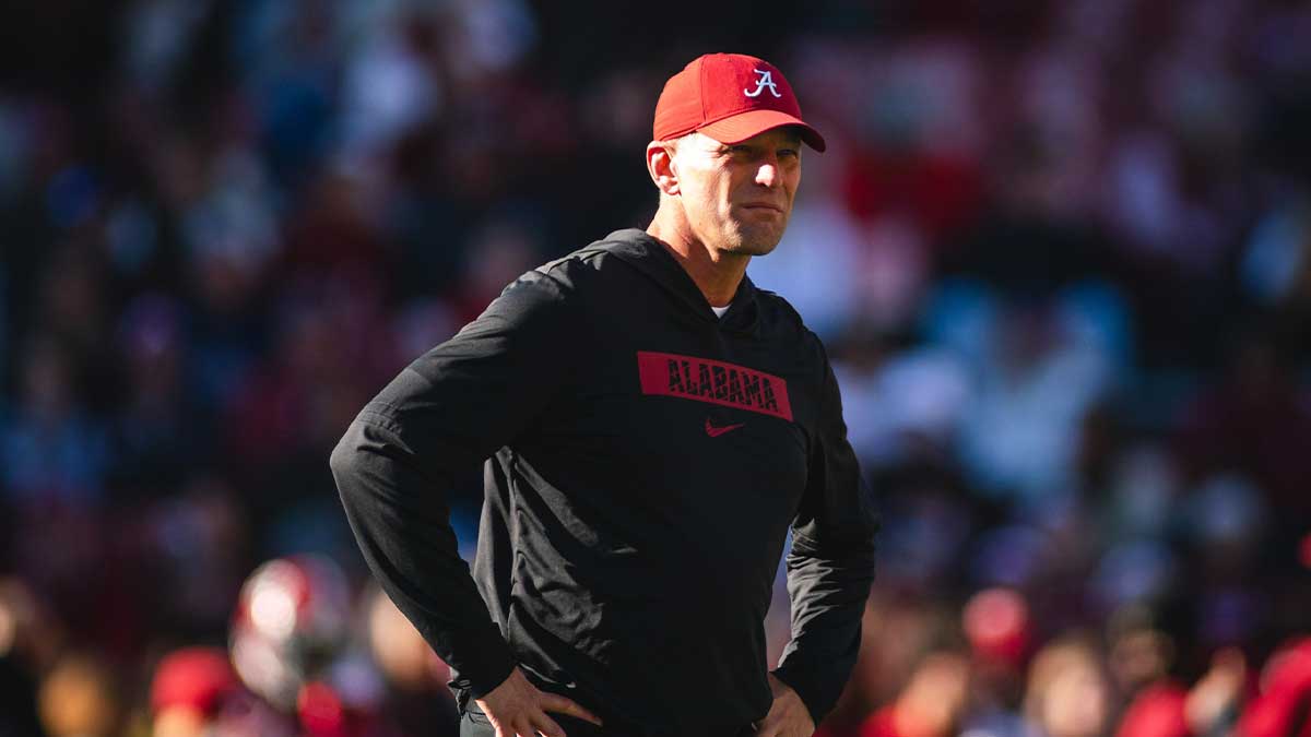 Alabama Crimson Tide head coach Kalen DeBoer walks onto the field before a game against the Auburn Tigers at Bryant-Denny Stadium