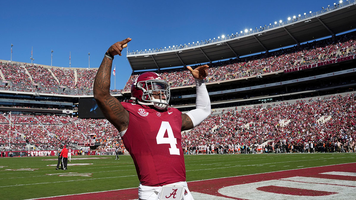 Alabama Crimson Tide quarterback Jalen Milroe (4) gestures to fans before the start of the Crimson Tide game with Mercer at Bryant-Denny Stadium.