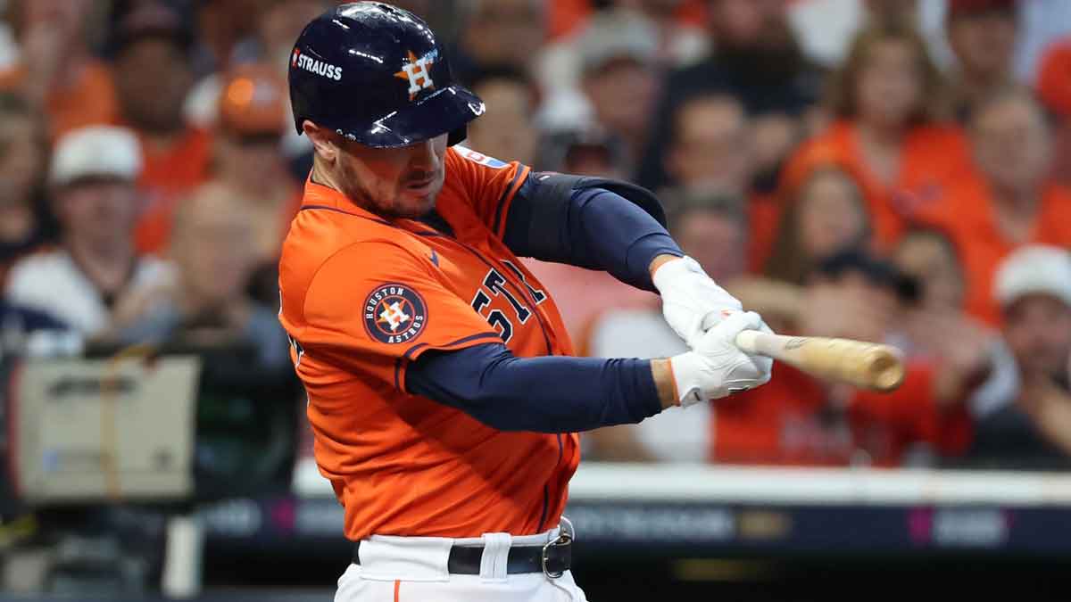 Oct 2, 2024; Houston, Texas, USA; Houston Astros third base Alex Bregman (2) hits a single against the Detroit Tigers during the second inning of game two of the Wildcard round for the 2024 MLB Playoffs at Minute Maid Park. 