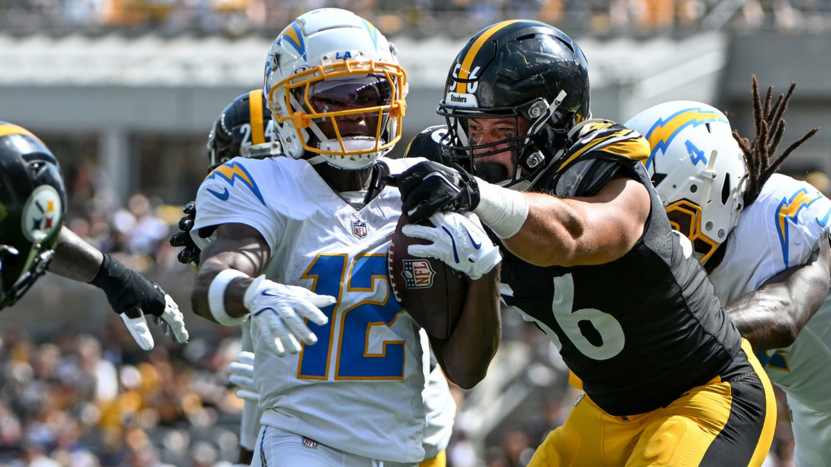 Pittsburgh Steelers linebacker Alex Highsmith (56) tackles Los Angeles Chargers wide receiver Derius Davis (12) during the second quarter at Acrisure Stadium.