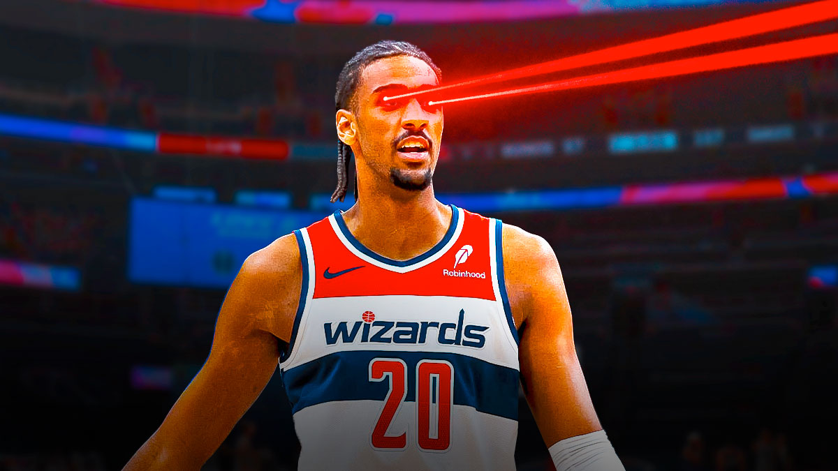 Alex Sarr smiles with laser eyes