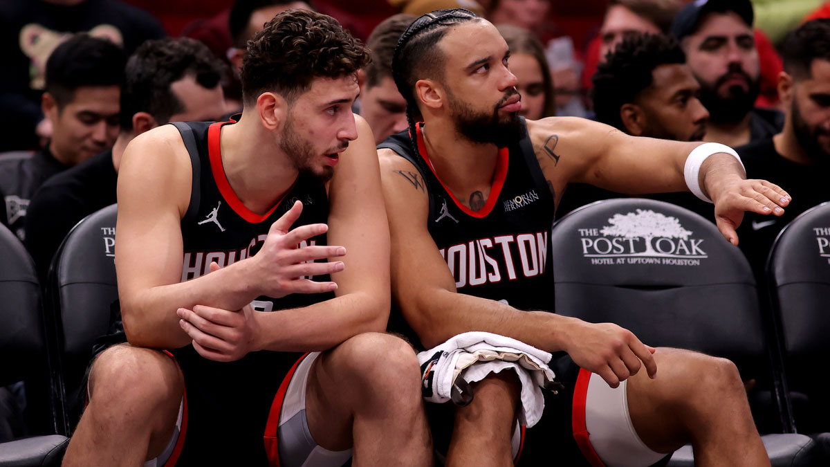 Houston Rockets center Alperen Sengun (28) and forward Dillon Brooks (9) interact on the bench against the Portland Trailblazers during the second quarter at Toyota Center.