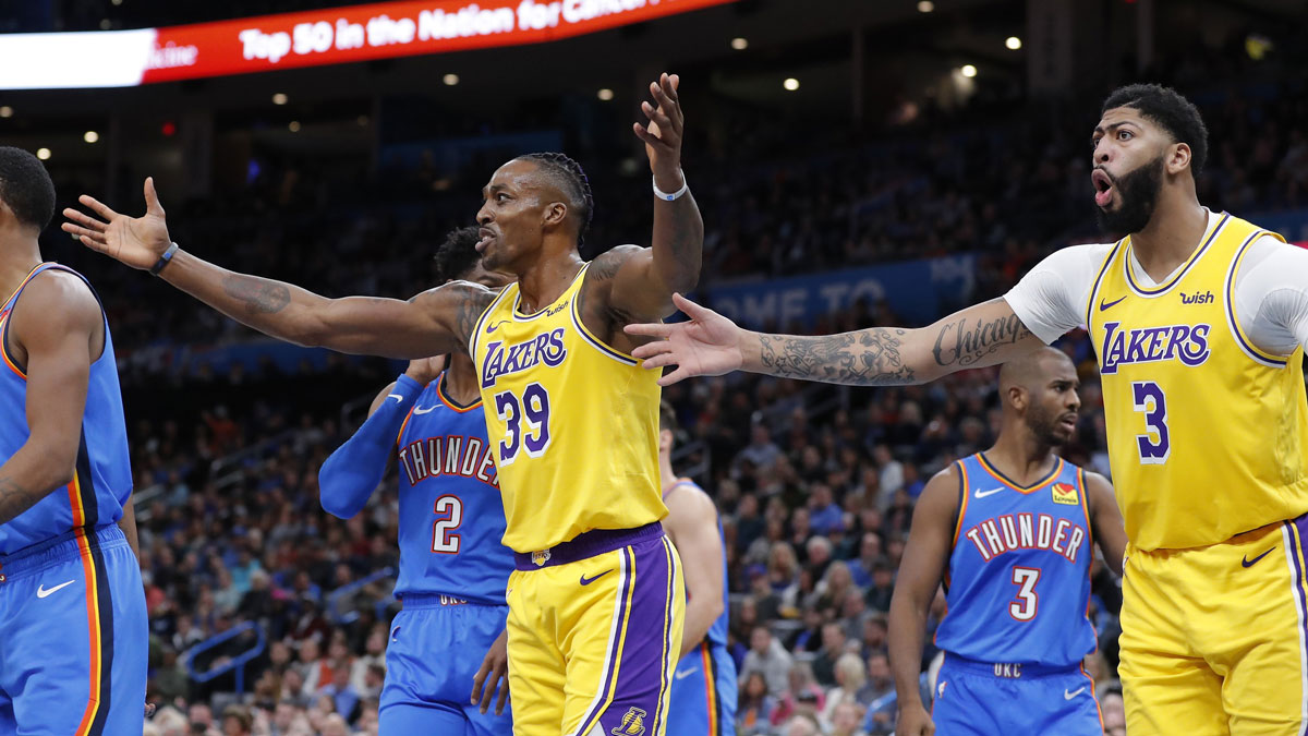 Los Angeles Lakers center Dwight Howard (39) and forward Anthony Davis (3) react to an officials call during the second quarter against the Oklahoma City Thunder at Chesapeake Energy Arena. Mandatory Credit: