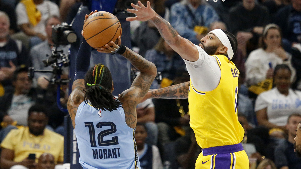 Los Angeles Lakers forward Anthony Davis (3) defends as Memphis Grizzlies guard Ja Morant (12) shoots in the first half during Game Five of the 2023 NBA Playoffs at FedExForum.