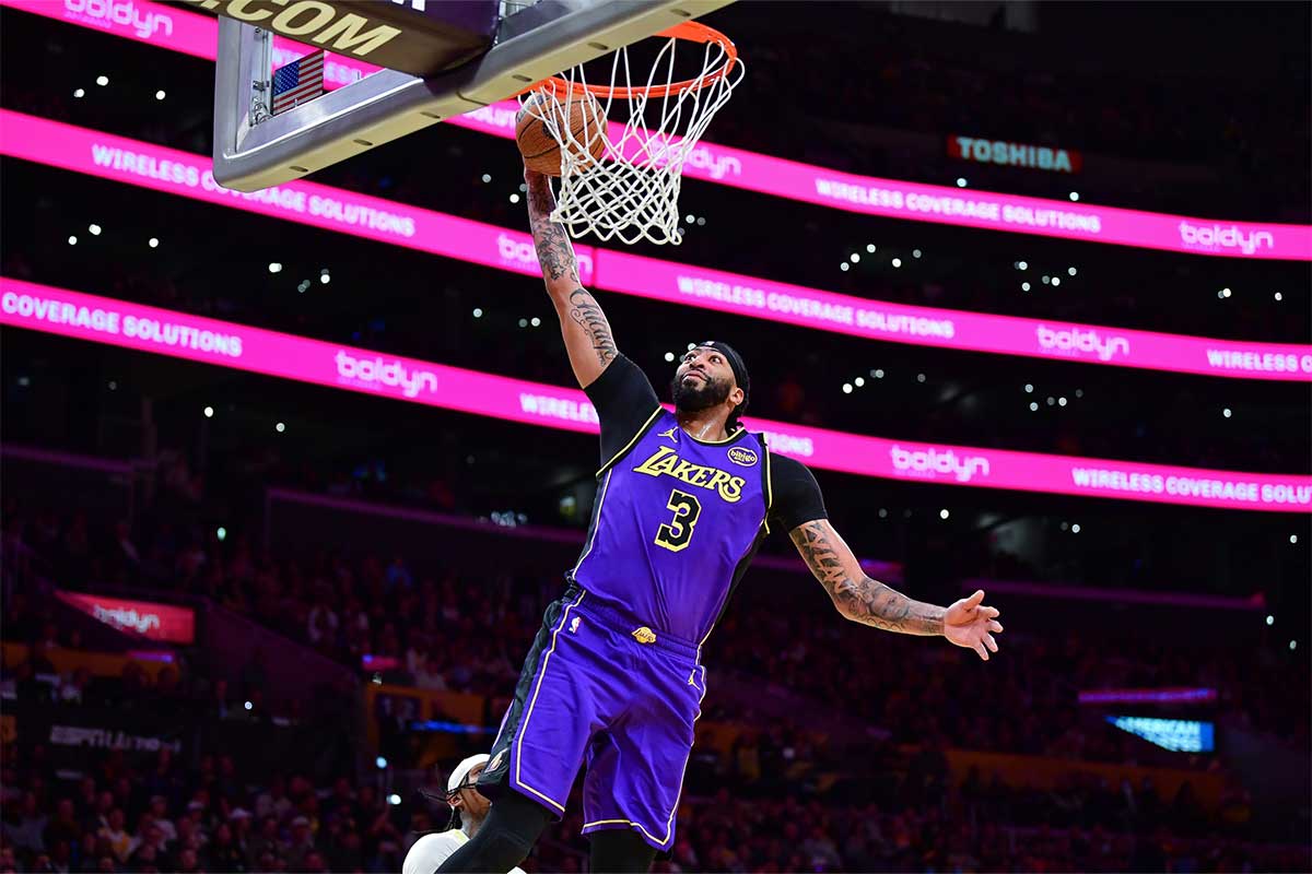 Los Angeles Lakers forward Anthony Davis (3) scores a basket against the Utah Jazz during the first half at Crypto.com Arena. 