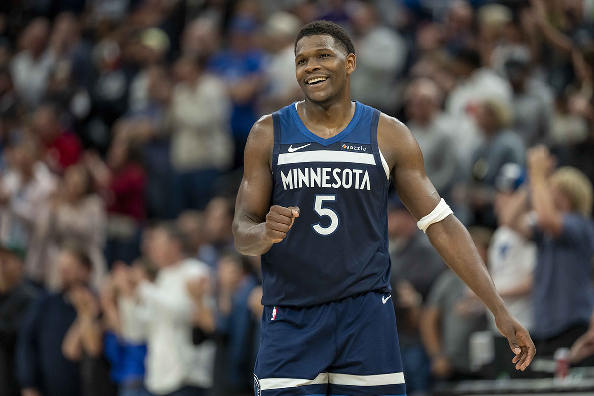 Minnesota Timberwolves guard Anthony Edwards (5) smiles after making a shot against the Miami Heat in the second half at Target Center. 