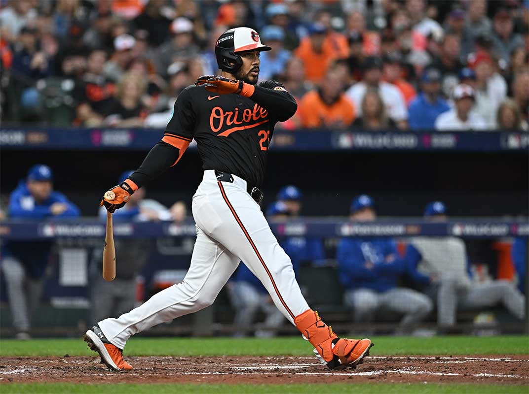 Baltimore Orioles outfielder Anthony Santander (25) hits a single in the fourth inning against the Kansas City Royals in game two of the Wild Card round for the 2024 MLB Playoffs at Oriole Park at Camden Yards. 