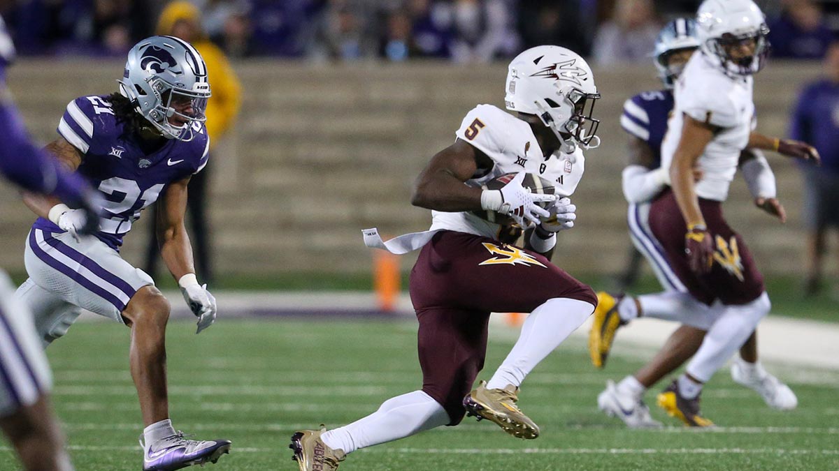 Arizona State Sun Devils wide receiver Melquan Stovall (5) is chased by Kansas State Wildcats safety Marques Sigle (21) during the third quarter at Bill Snyder Family Football Stadium.