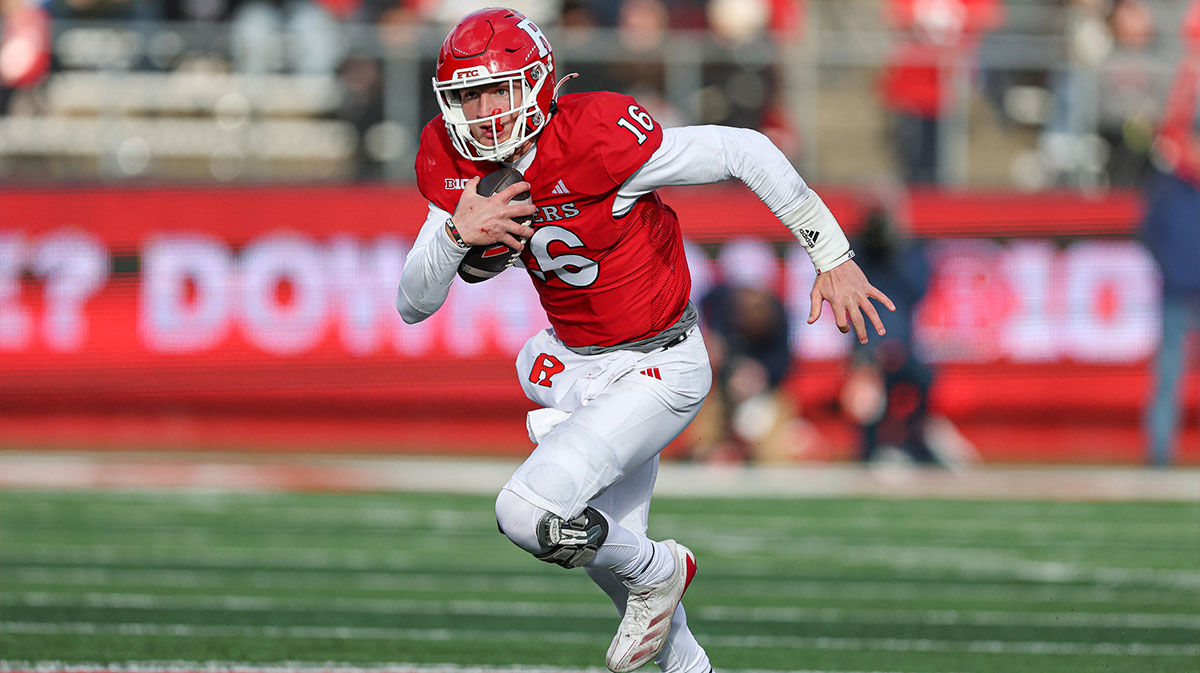 Rutgers Scarlet Knights quarterback Athan Kaliakmanis (16) carries the ball during the second half against the Illinois Fighting Illini at SHI Stadium.