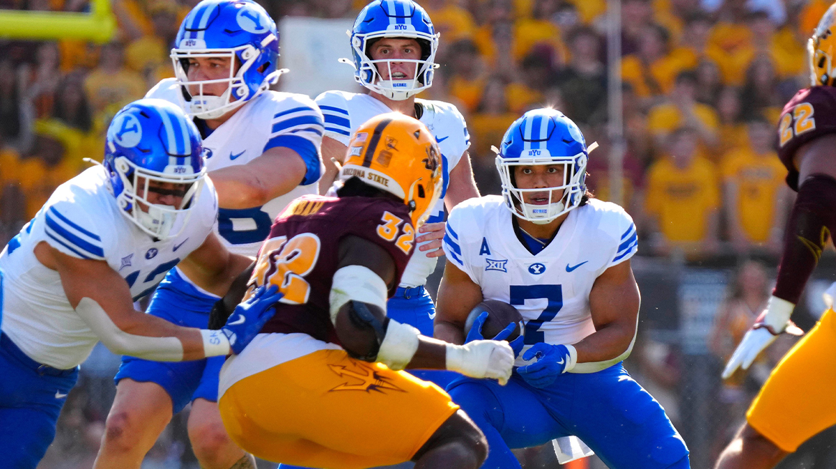 BYU running back Hinckley Ropati (7) looks for daylight against Arizona State during the first half at Mountain America Stadium in Tempe.