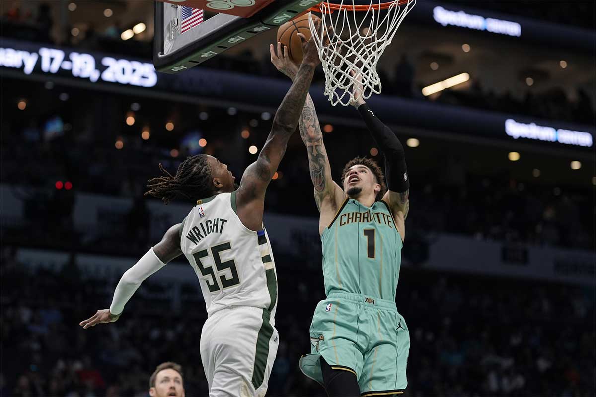 Charlotte Hornets guard LaMelo Ball (1) shoots over Milwaukee Bucks guard Delon Wright (55) during the second half at Spectrum Center.