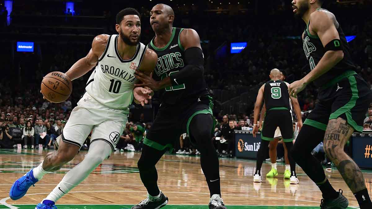 Brooklyn Nets guard Ben Simmons (10) controls the ball while Boston Celtics center Al Horford (42) defends during the first half at TD Garden.