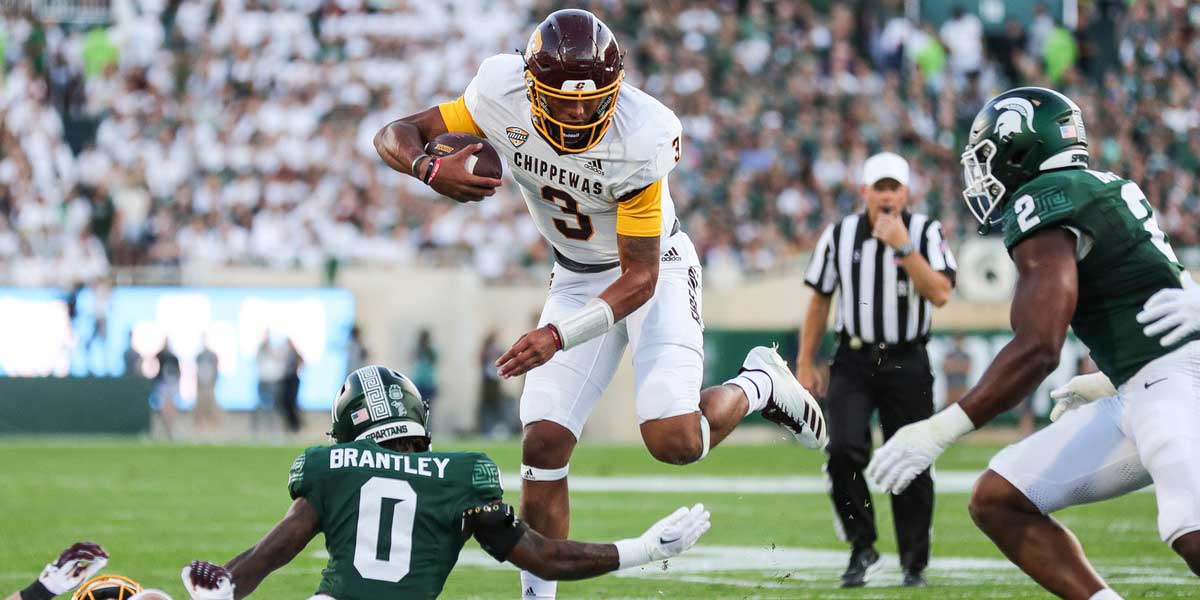 Central Michigan quarterback Bert Emanuel Jr. (3) runs against Michigan State defensive back Charles Brantley (0) during the first half at Spartan Stadium in East Lansing on Friday, Sept. 1, 2023