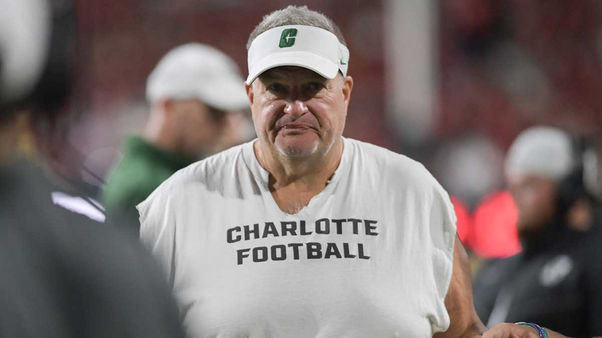 Charlotte 49ers head coach Biff Poggi walks down the sidelines during the first half against the Maryland Terrapins at SECU Stadium.