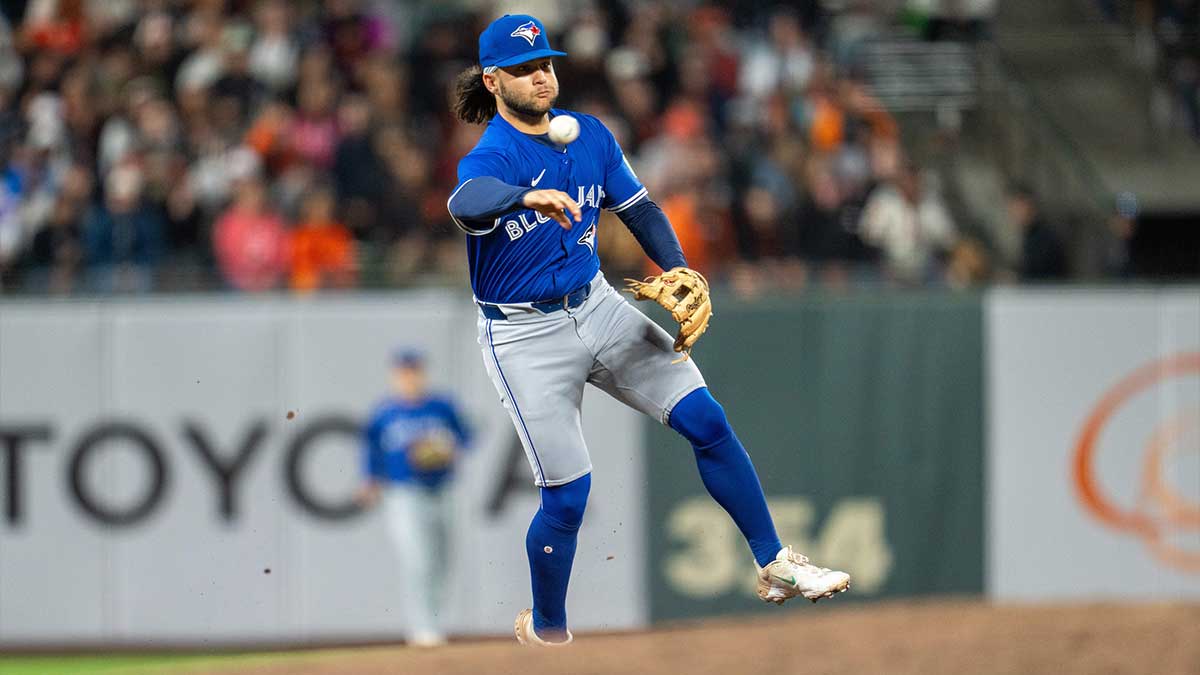 Toronto Blue Jays shortstop Bo Bichette (11) throws out San Francisco Giants first baseman Wilmer Flores (41) during the ninth inning at Oracle Park.