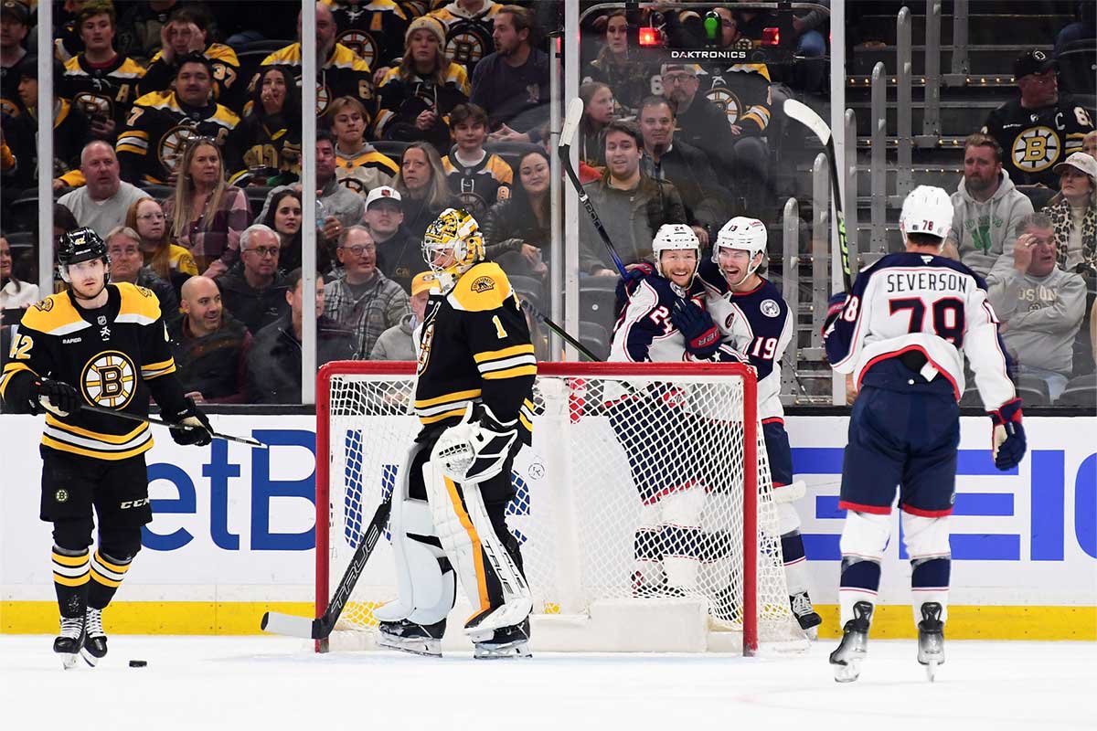 Columbus Blue Jackets right wing Mathieu Olivier (24) reacts with center Adam Fantilli (19) after scoring a goal during the first period against the Boston Bruins at TD Garden.