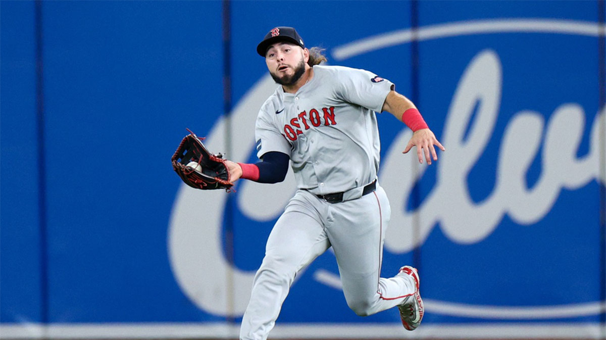 Boston Red Sox outfielder Wilyer Abreu (52) catches a fly ball against the Tampa Bay Rays in the third inning at Tropicana Field. Mandatory Credit: