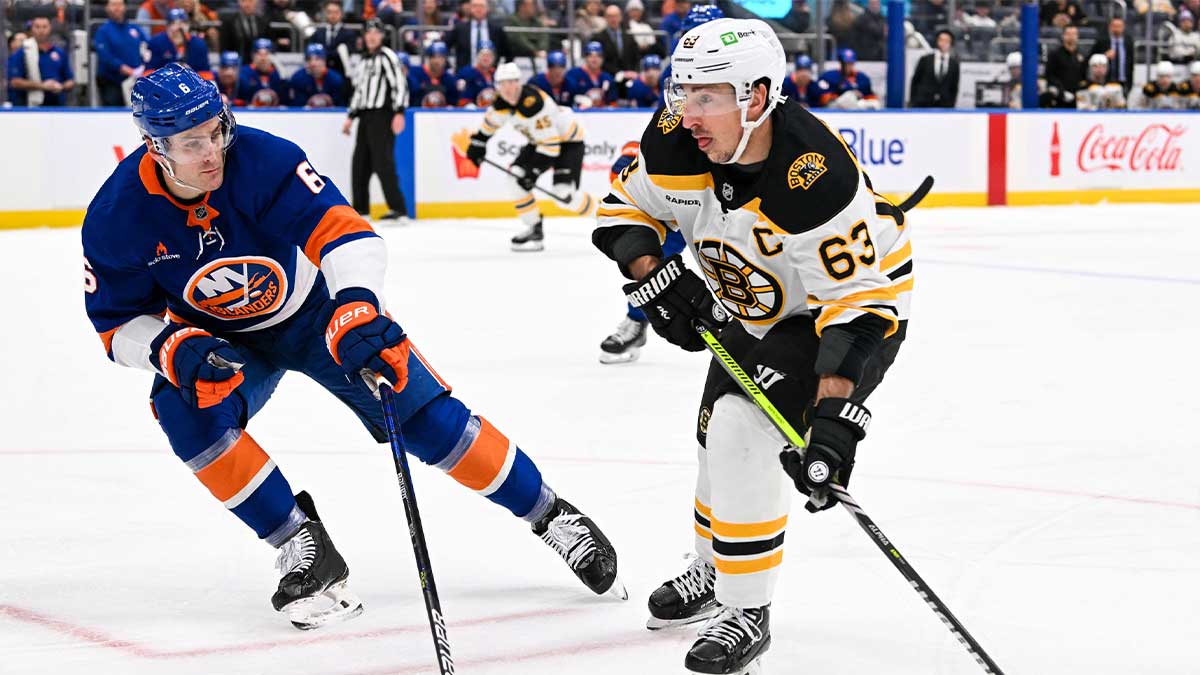 New York Islanders defenseman Ryan Pulock (6) defends against Boston Bruins left wing Brad Marchand (63) during the first period at UBS Arena.