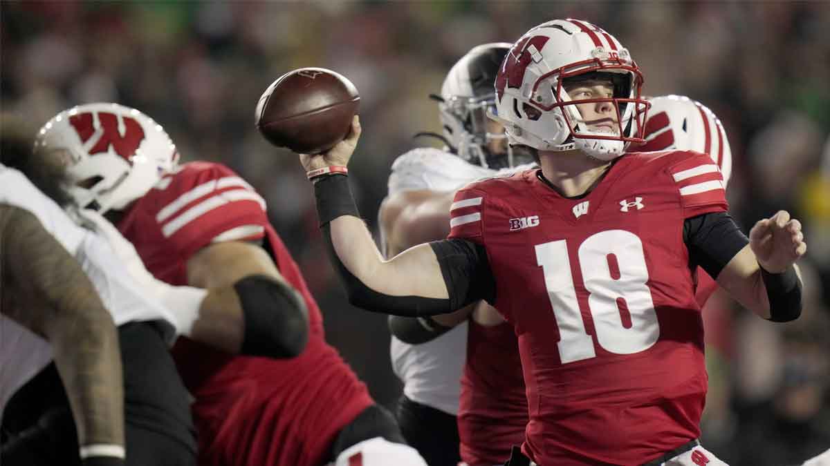 Wisconsin quarterback Braedyn Locke (18) throws during the first quarter of their game against Oregon Saturday, November 16, 2024 at Camp Randall Stadium in Madison, Wisconsin.