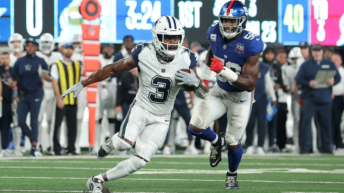 Dallas Cowboys wide receiver Brandin Cooks (3) runs with the ball against New York Giants linebacker Bobby Okereke (58) during the first quarter at MetLife Stadium.