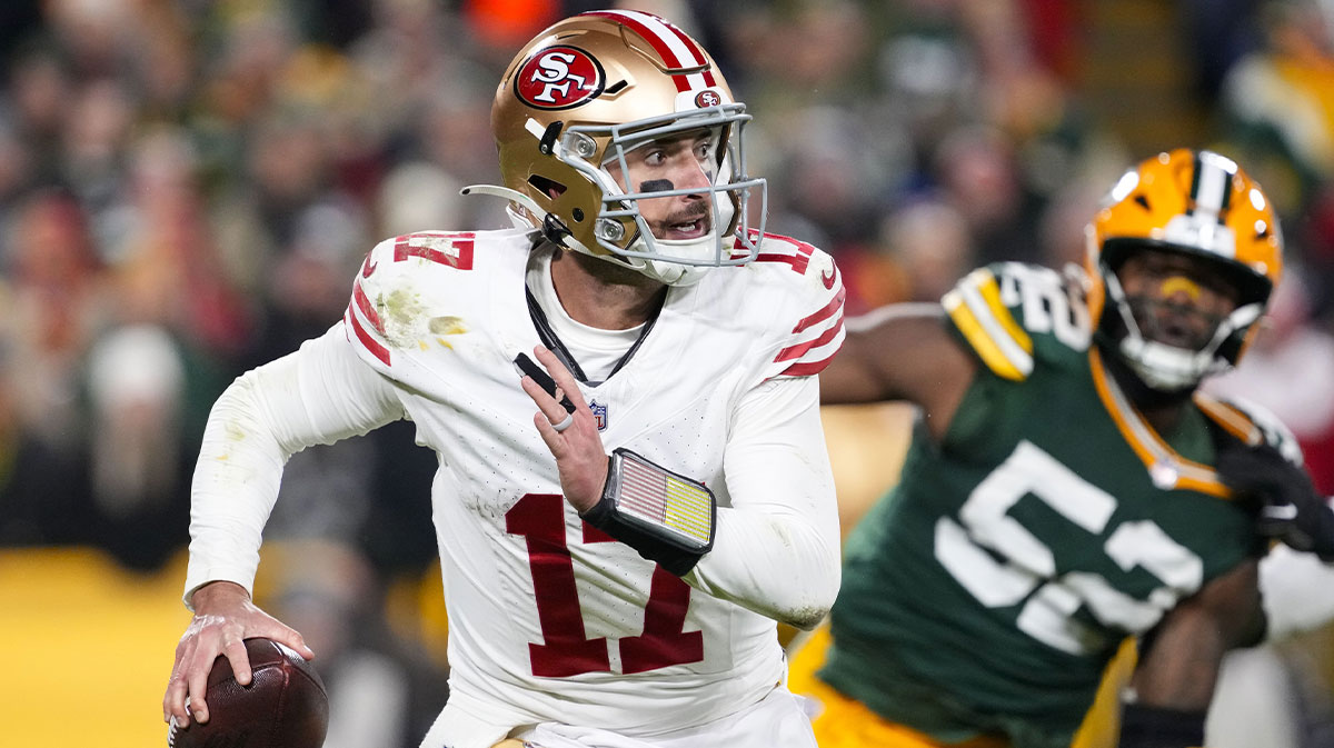 San Francisco 49ers quarterback Brandon Allen (17) scrambles away from pressure applied by Green Bay Packers defensive lineman Rashan Gary (52) during the fourth quarter at Lambeau Field.