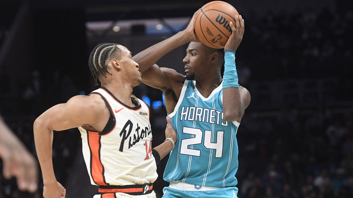 Charlotte Hornets forward Brandon Miller (24) looks to pass as he is defended by Detroit Pistons Wendell Moore Jr. (14) during the second half at the Spectrum Center. 