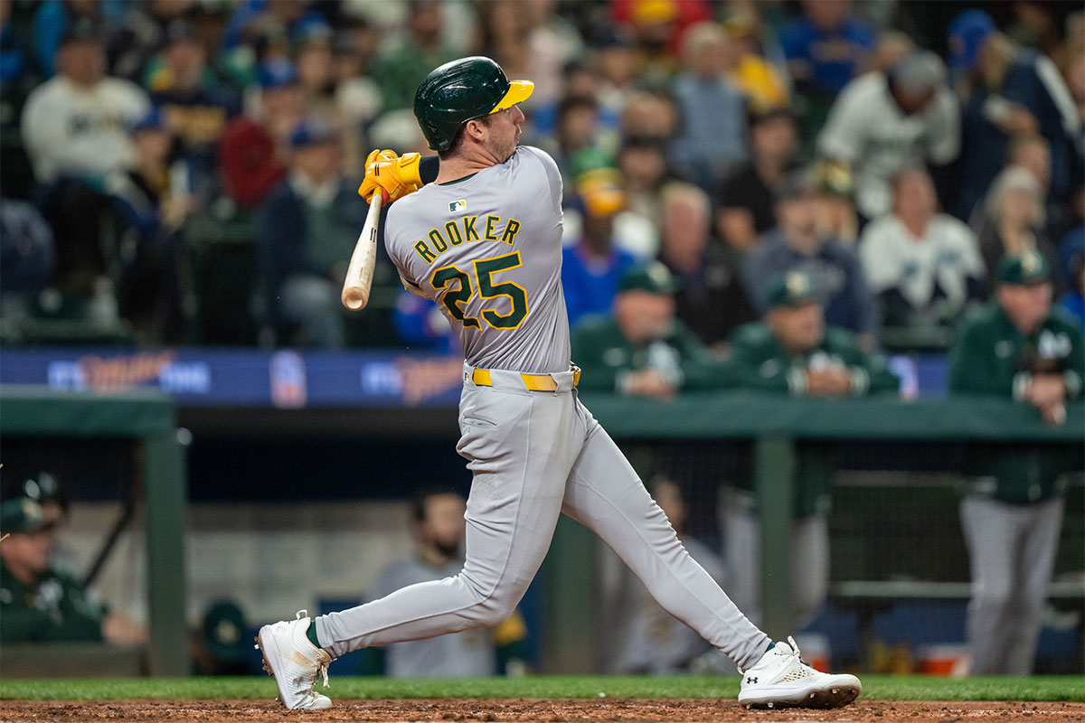 Oakland Athletics designated hitter Brent Rooker (25) hits a two-run home run during the fifth inning against the Seattle Mariners at T-Mobile Park.