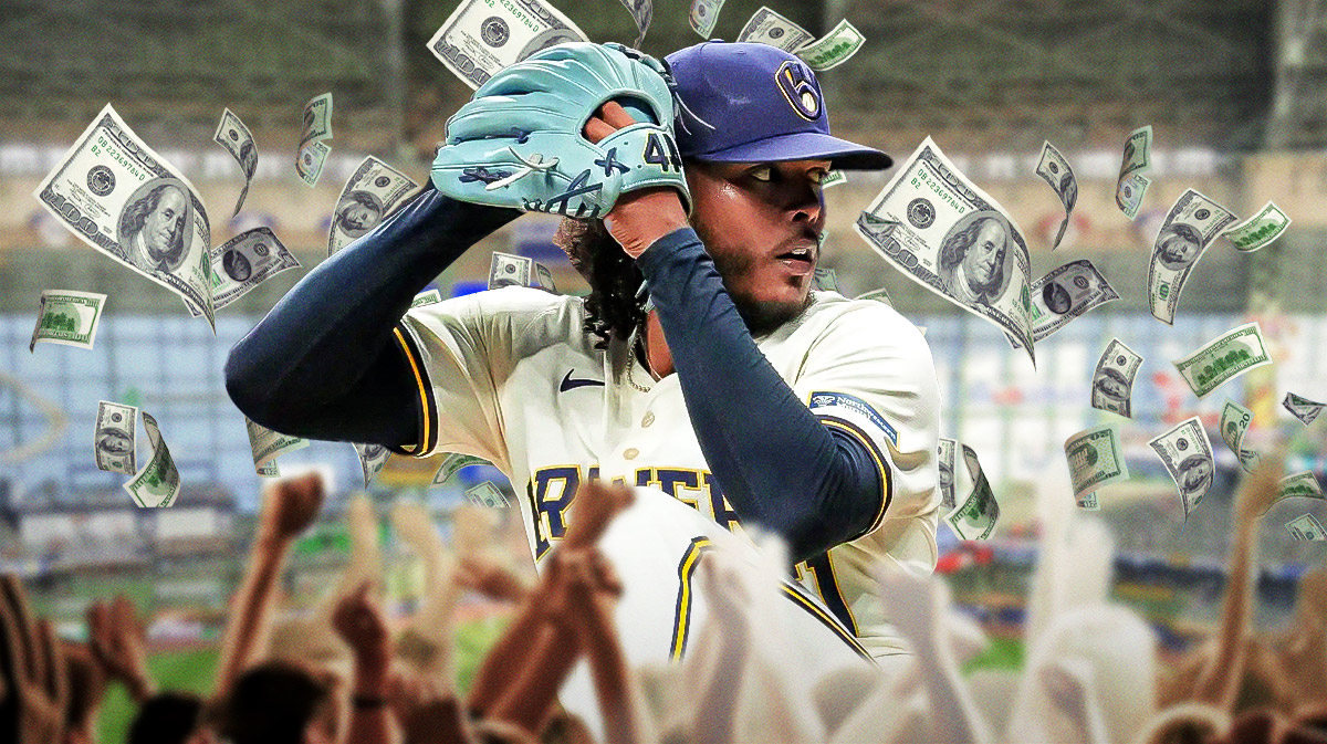 Photo: Freddy Peralta in action in Brewers jersey with money flying around him