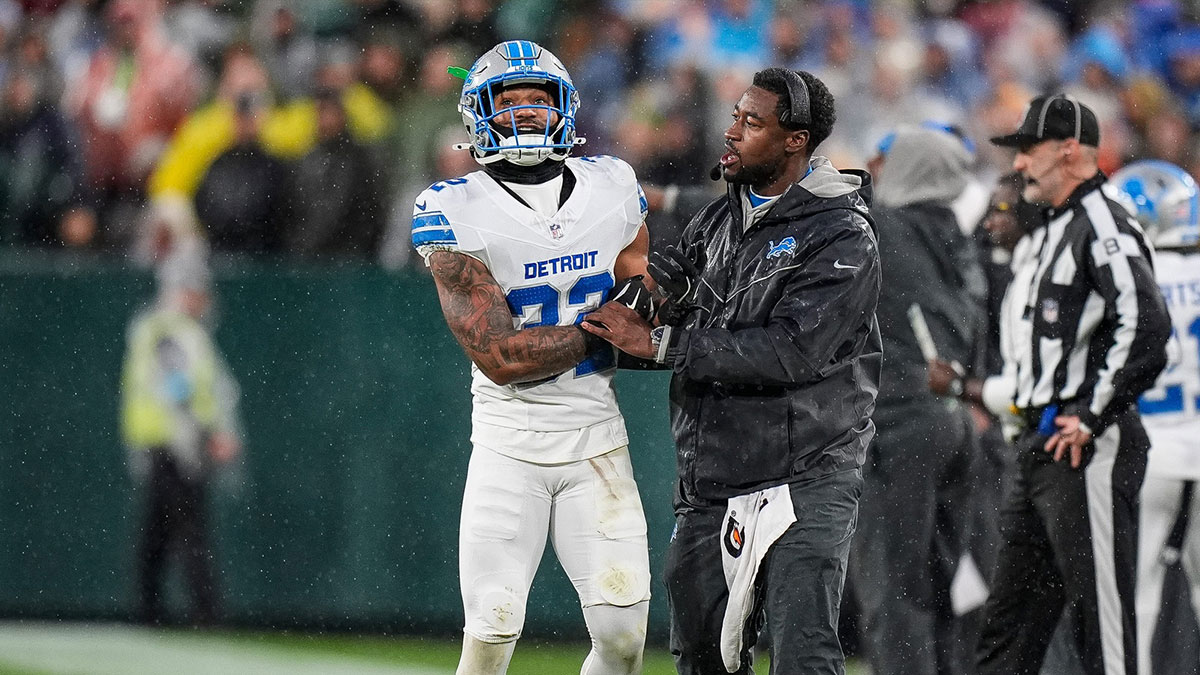 Detroit Lions safety Brian Branch talks to assistant linebackers coach Shaun Dion Hamilton after being disqualified by the referee during the first half against Green Bay Packers at Lambeau Field in Green Bay, Wis. on Sunday, Nov. 3, 2024.