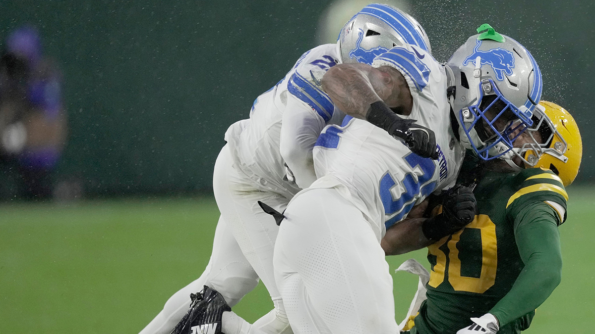 Detroit Lions safety Brian Branch (32) hits Green Bay Packers wide receiver Bo Melton (80) during the first quarter of their game Sunday, November 3, 2024 at Lambeau Field in Green Bay, Wisconsin. Branch was ejected from the game because of the hit.