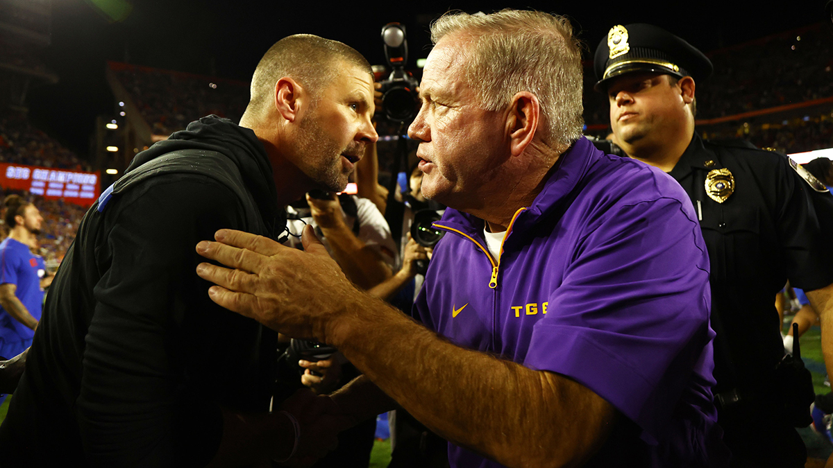 LSU Tigers head coach Brian Kelly and Florida Gators head coach Billy Napier greet after the game at Ben Hill Griffin Stadium.